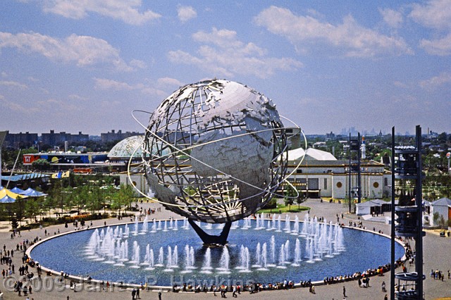 slides/01 - WF65_04.jpg  Unisphere, taken from Cable Car 12 Stories high, stainless steel model of Earth. Designed by landscape architect, Gilmore Clark. I weighs 700,000 lb and is 120 ft in diameter.